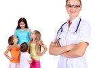 Friendly female doctor and family with children on the background