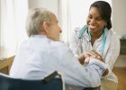 Nurse and elderly man spending time together --- Image by © Jose Luis Pelaez, Inc./Blend Images/Corbis